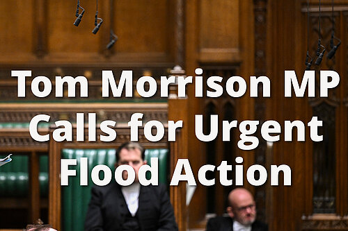 Graphic showing Tom in Parliament with text reading Tom Morrison MP Calls for Urgent Flooding Action